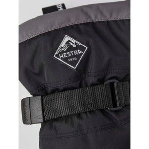 Hestra black glove cuff with adjustable strap and brand logo patch