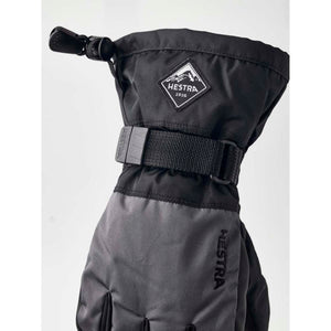 Hestra black winter mitten with adjustable wrist strap and mountain logo patch