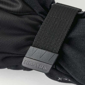 Black Hestra glove wrist strap with adjustable velcro closure