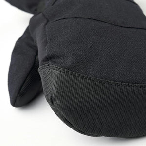 Hestra black mitten showing textured fabric detail
