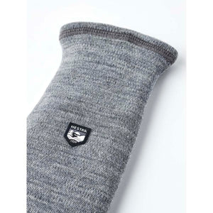 Grey Hestra wool glove cuff with brand logo patch