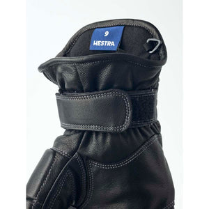Black leather Hestra glove cuff with adjustable velcro strap and size nine label