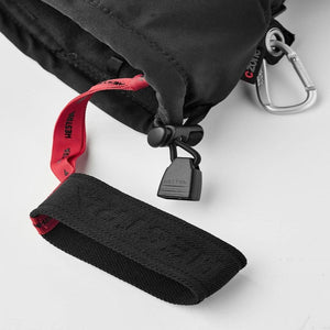Hestra glove cuff detail with red pull tab and black wrist strap