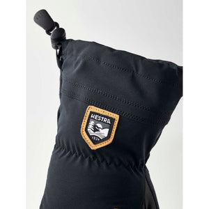 Black Hestra mitten cuff with adjustable drawstring and branded patch