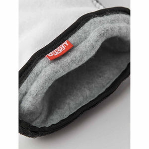 Interior of a Hestra glove showing grey fleece lining and G-Loft insulation tag