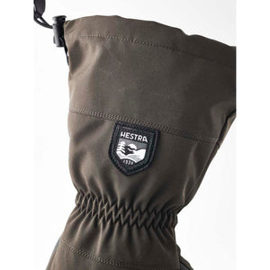 Olive green Hestra glove cuff with drawstring and brand logo patch