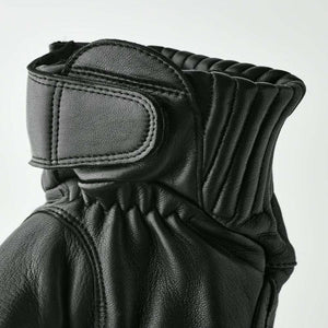 Hestra black leather glove cuff with velcro strap and ribbed detailing