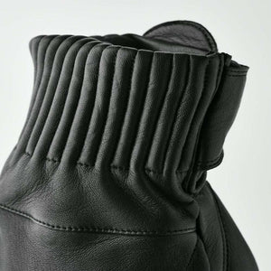 Close up of black Hestra leather glove cuff with ribbed detailing