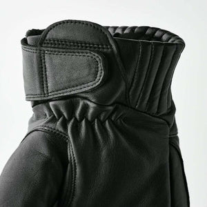 Close up of black leather motorcycle glove cuff with velcro strap