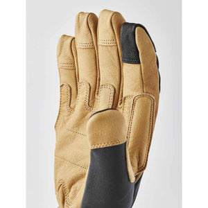 Hestra tan leather glove with black fabric accents on the thumb and index finger