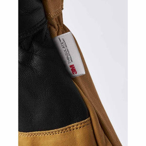 Hestra glove detail showing 3M Thinsulate insulation label on brown and black leather