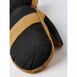 Hestra black and tan leather mitten close up