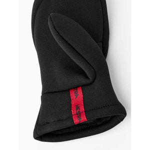 Black Hestra mitten with red logo tab on the wrist