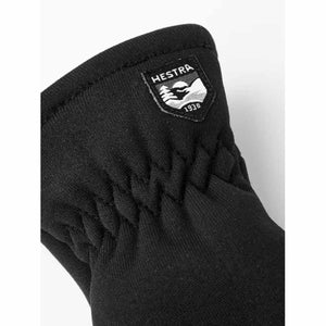Black Hestra glove cuff with gathered fabric and Hestra brand logo patch