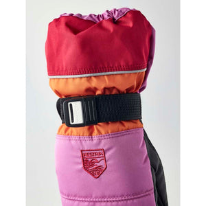 Hestra colorblocked pink and orange winter mitten with adjustable wrist strap