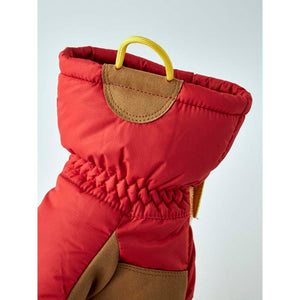 Hestra red insulated mitten cuff with yellow pull loop and brown suede detailing