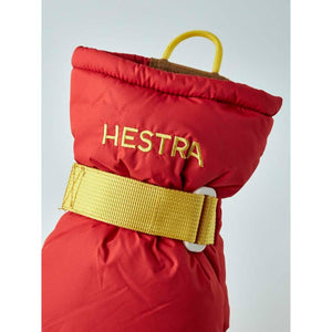 Red Hestra mitten cuff with yellow strap and pull loop