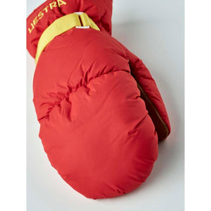 Red Hestra insulated mitten with yellow wrist strap