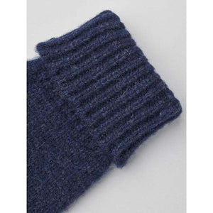Close up of a navy blue ribbed wool knit cuff