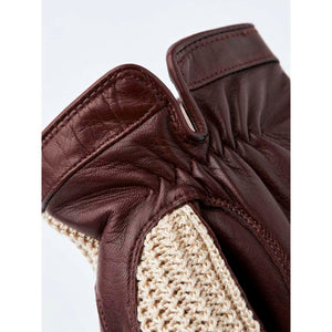 Close up of Hestra brown leather and beige crochet glove cuff
