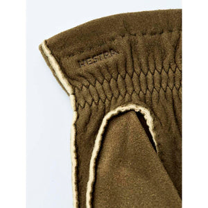 Olive green Hestra glove cuff with embossed logo and quilted detailing