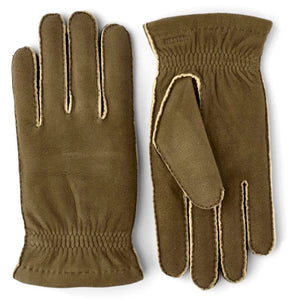 Hestra olive green suede gloves with exposed seams and elasticated wrists