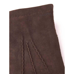 Close up of brown Hestra suede glove cuff with decorative stitching