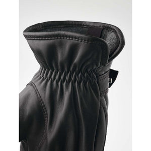 Close up of black Hestra leather glove cuff with elasticated wrist detail