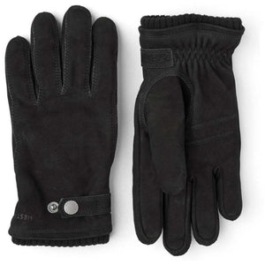 Pair of black Hestra suede gloves with snap button closure and ribbed cuffs