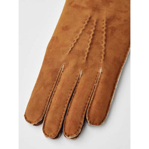 Hestra brown suede glove with decorative stitching on the back