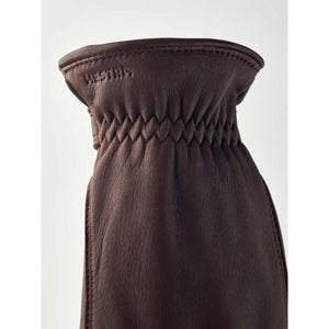 Brown Hestra leather glove cuff with elasticated wrist detail