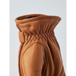 Close up of Hestra tan leather glove cuff with elasticated wrist detail