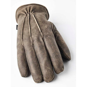 Hestra brown leather glove with decorative stitching on the back