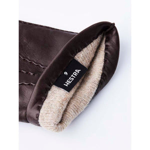 Hestra brown leather glove cuff with beige wool lining and size nine label