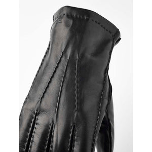 Hestra black leather glove with decorative stitching on the back