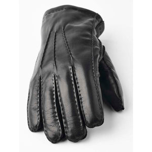 Black leather glove with decorative stitching on the back