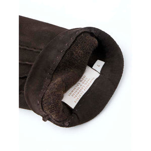 Hestra brown suede glove interior showing size seven label and material composition