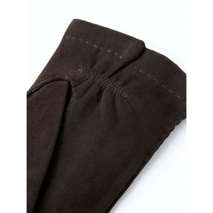 Close up of dark brown Hestra suede glove cuff with visible stitching