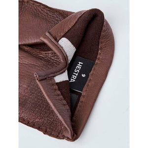 Interior of brown Hestra leather glove showing size 9 label