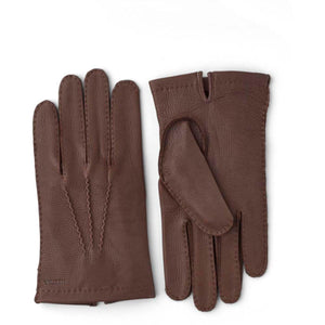 Hestra brown leather gloves with decorative stitching on the back