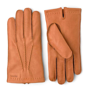 Hestra tan leather gloves with decorative stitching on the back