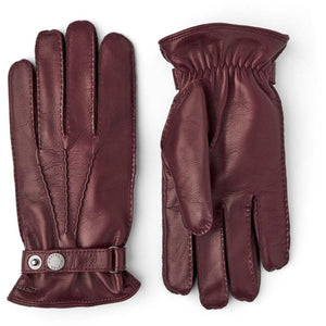 Hestra burgundy leather gloves with wrist strap and snap button closure