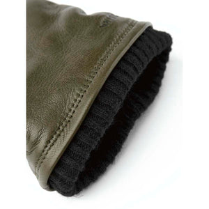 Hestra olive green leather glove cuff with black ribbed knit lining