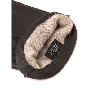 Interior of Hestra deerskin glove showing merino wool lining and material tag