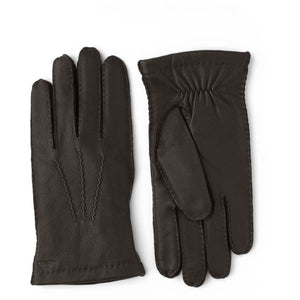 Hestra dark brown leather gloves with decorative stitching on the back