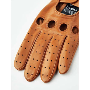 Tan Hestra leather driving gloves with knuckle cutouts and perforated fingers