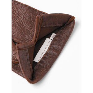 Interior of Hestra brown peccary leather glove showing size 8.5 label