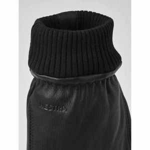 Black Hestra leather glove cuff with ribbed knit trim