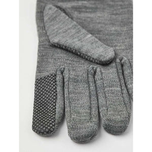 Hestra grey knit glove with textured grip pattern on index finger and thumb