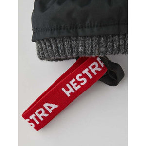 Hestra glove cuff with a red branded wrist strap